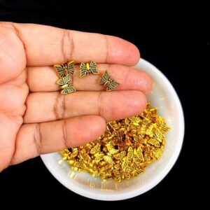 OXIBEADG0001- 50 GM PACK OF GOLDEN BUTTERFLY MOTIF GERMAN SILVER METAL BEADS