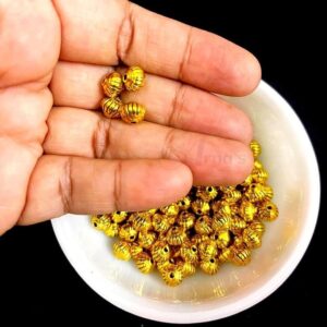 OXIBEADG0008- 50 GM PACK OF GOLDEN ROUND MOTIF GERMAN SILVER METAL BEADS