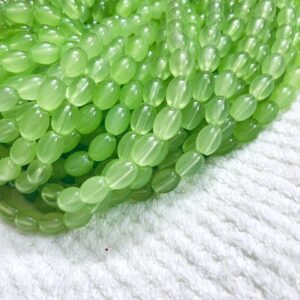 OVALBEADS13- 1 STRAND PARROT GREEN 10 X 8 MM OVAL SHAPED GLASS BEADS