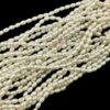 PEARLBEADS0006 - 1 STRAND IVORY WHITE 0.6 x 0.4 CM OVAL PEARL BEADS