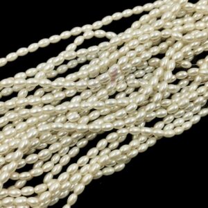PEARLBEADS0006 - 1 STRAND IVORY WHITE 0.6 x 0.4 CM OVAL PEARL BEADS