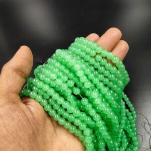 RGLASS0063 – 1 STRAND JADE GREEN 6MM ROUND GLASS BEADS