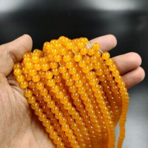 RGLASS0077 – 1 STRAND SAFFRON 6MM ROUND GLASS BEADS